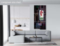 A three-panel vertical triptych art print of "The Redhead Piano Bar" neon sign, measuring 36x72 inches, mounted on a light grey wall above a modern grey sectional sofa in a bright living room with a view of a kitchen.